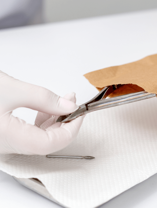 hands are taking manicure tools from craft envelope before manicure procedure 2 min